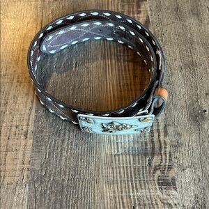 Genuine leather buck stitch belt.